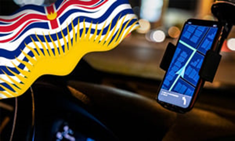 A close-up of a phone in a carDescription automatically generated